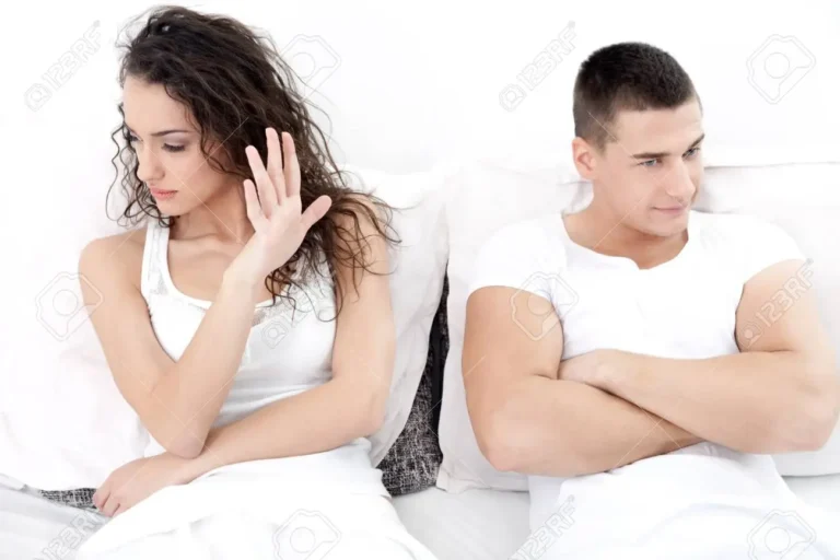 unhappy-young-couple-in-bedroom-under-stress